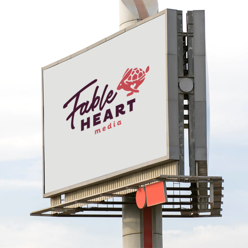 The Fable Heart Media logo on a large billboard
